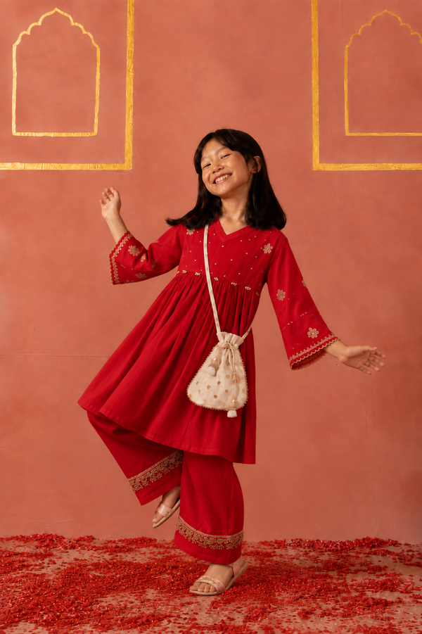 Red embroidered peplum kurta pants and potli