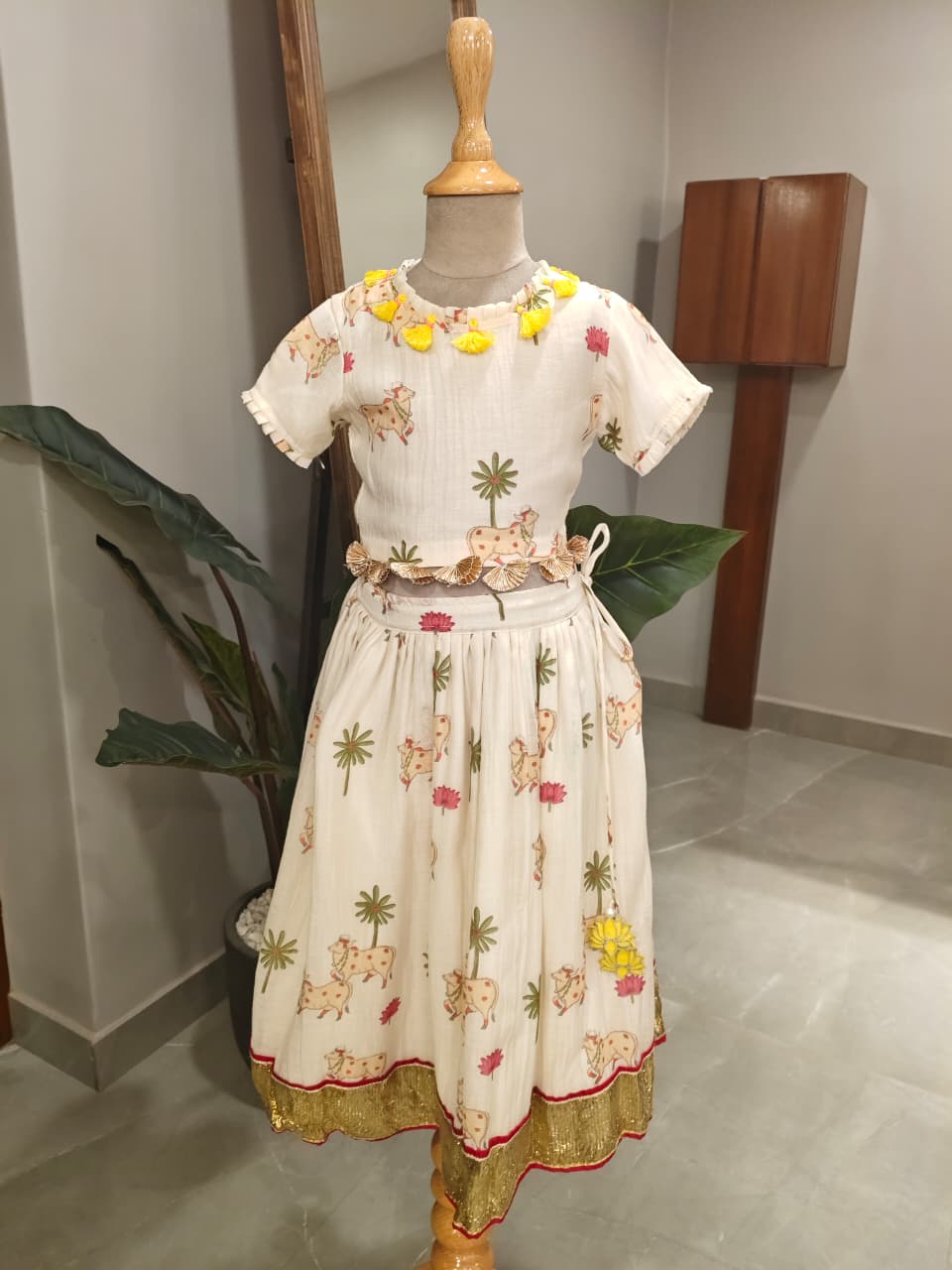 Adorable Printed Top With Fringed Detailing And Lehenga